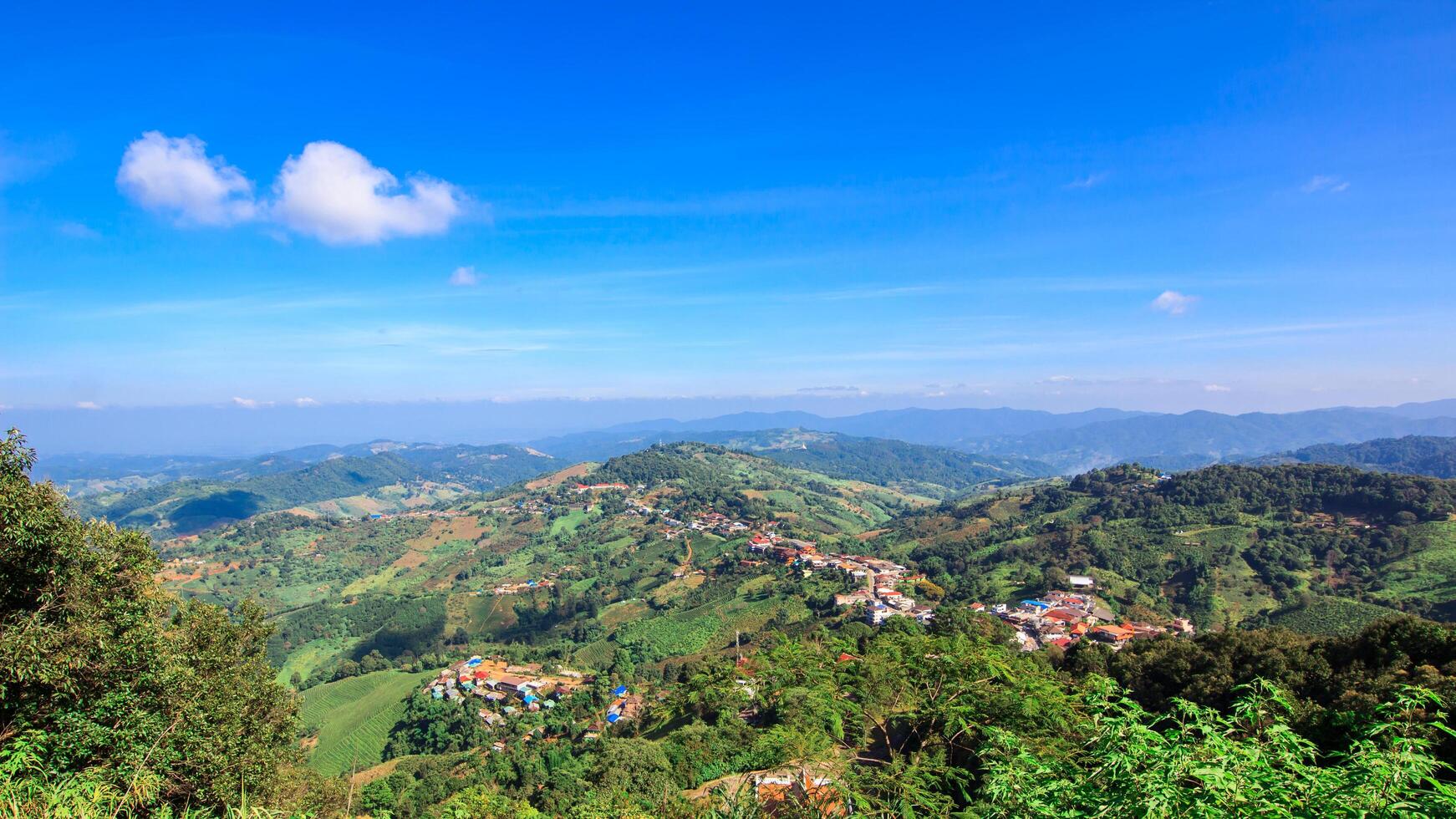 Village on Doi Mae Salong Chiang Rai Province, Thailand Hill tribe house,Mountain and Blue Sky photo