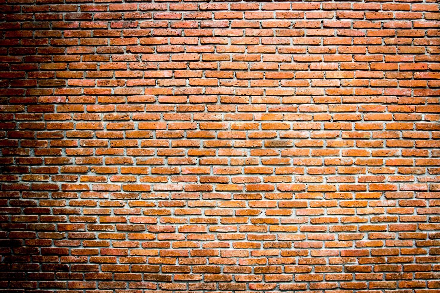Brick wall or red brick dark tone of color for background texture photo