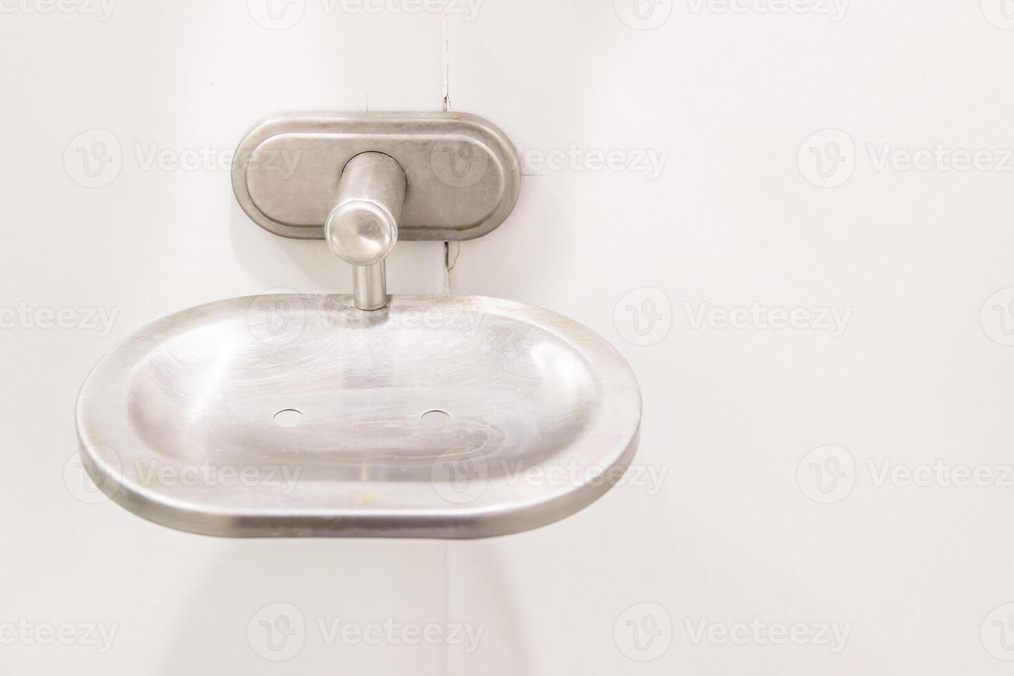 Soap tray used in bathroom have a stain and  Stone tiles with hotel concept photo