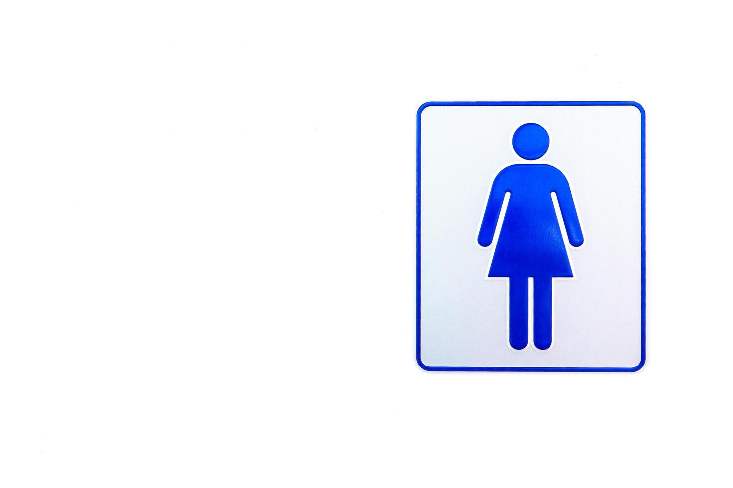 Women Toilet symbol on the white cement wall and blue color for mark photo