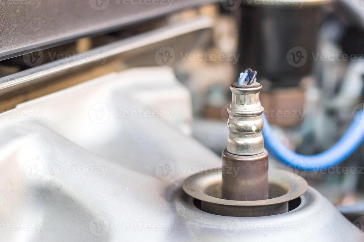 Close up Oxygen or intake sensor of car in engine room part of automobile concept for texture photo