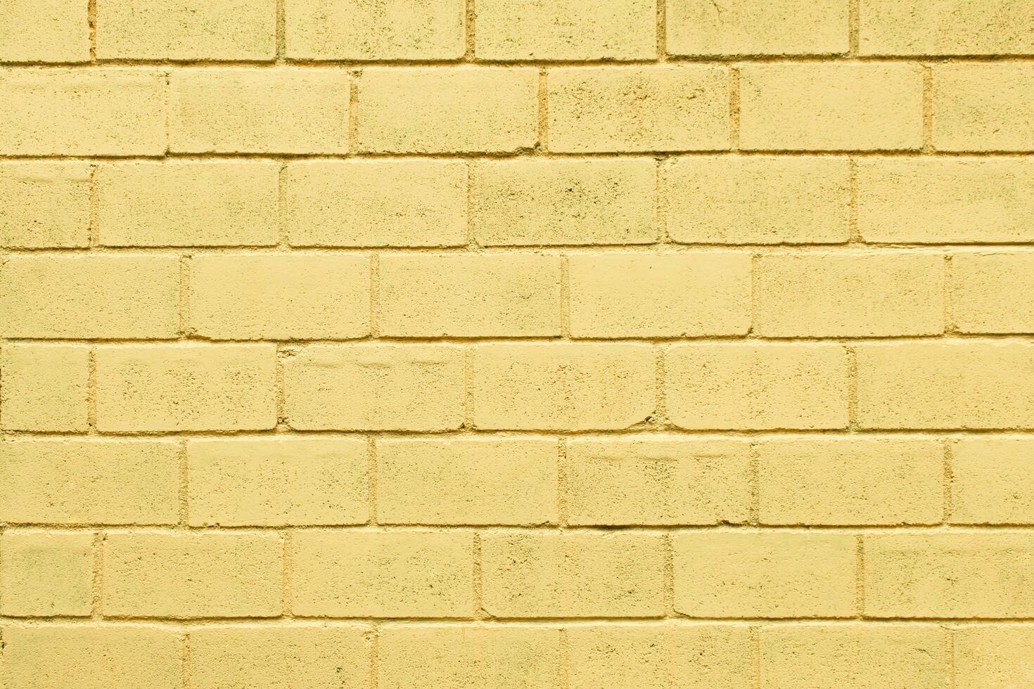 Light yellow color brick wall close up image row brick and cement block background and texture photo