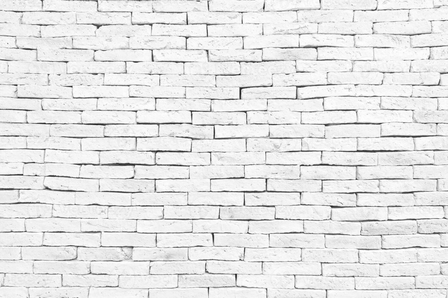 bloque de pared de ladrillo blanco claro viejo y agrietado para el fondo, espacio de copia de textura foto