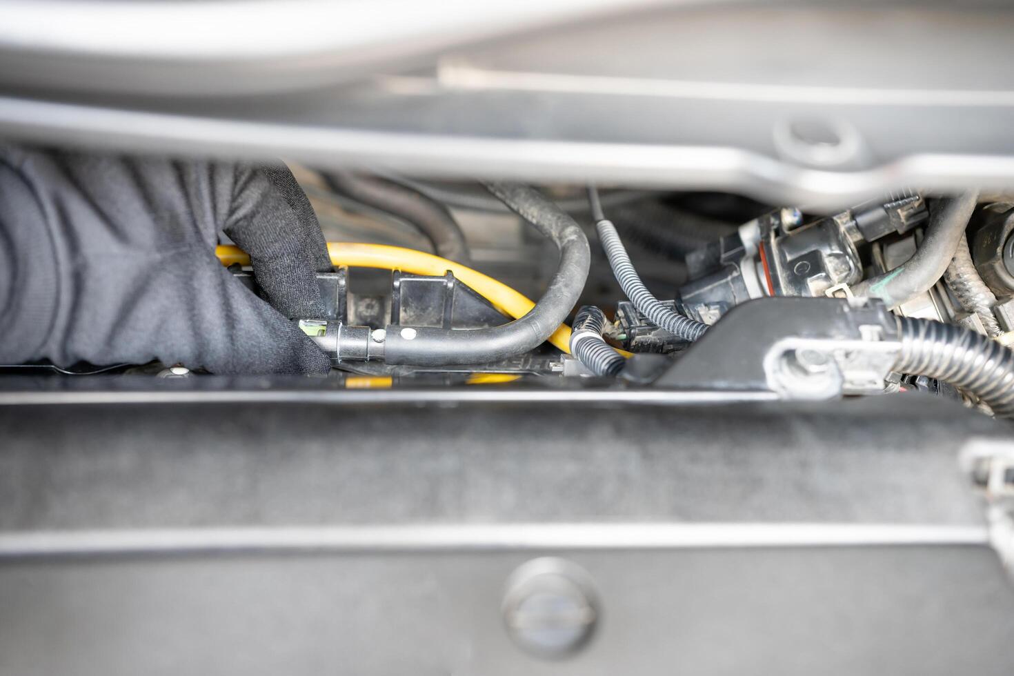 Hand Technician check and adjust gasoline Rubber hose Fuel system cable of gasoline engine Check fuel system of car concept photo