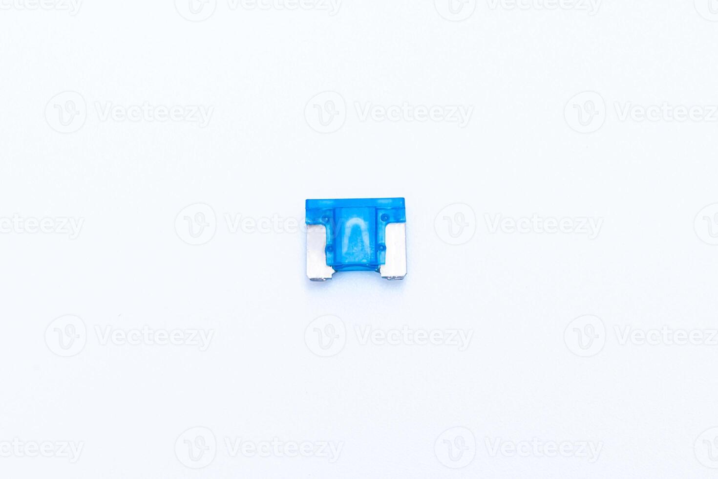 Car fuse on white background micro size use for protection in electric system of car photo