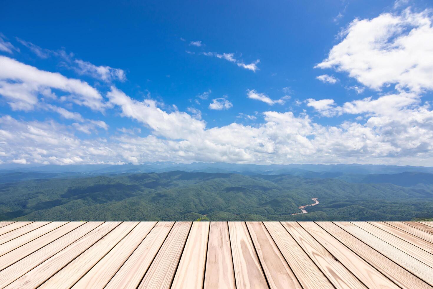 Empty top wooden board table and view of mountain and blue sky use for product display and background and copy space photo