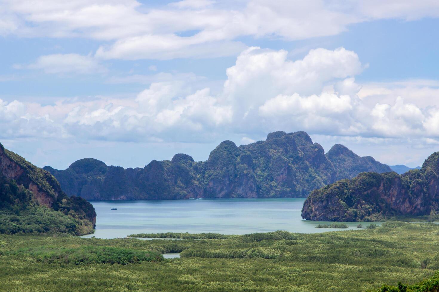 Mountain view and sea with blue sky cloud land mark for tourists in Samed Nang Phi,Phang Nga,Thailand photo