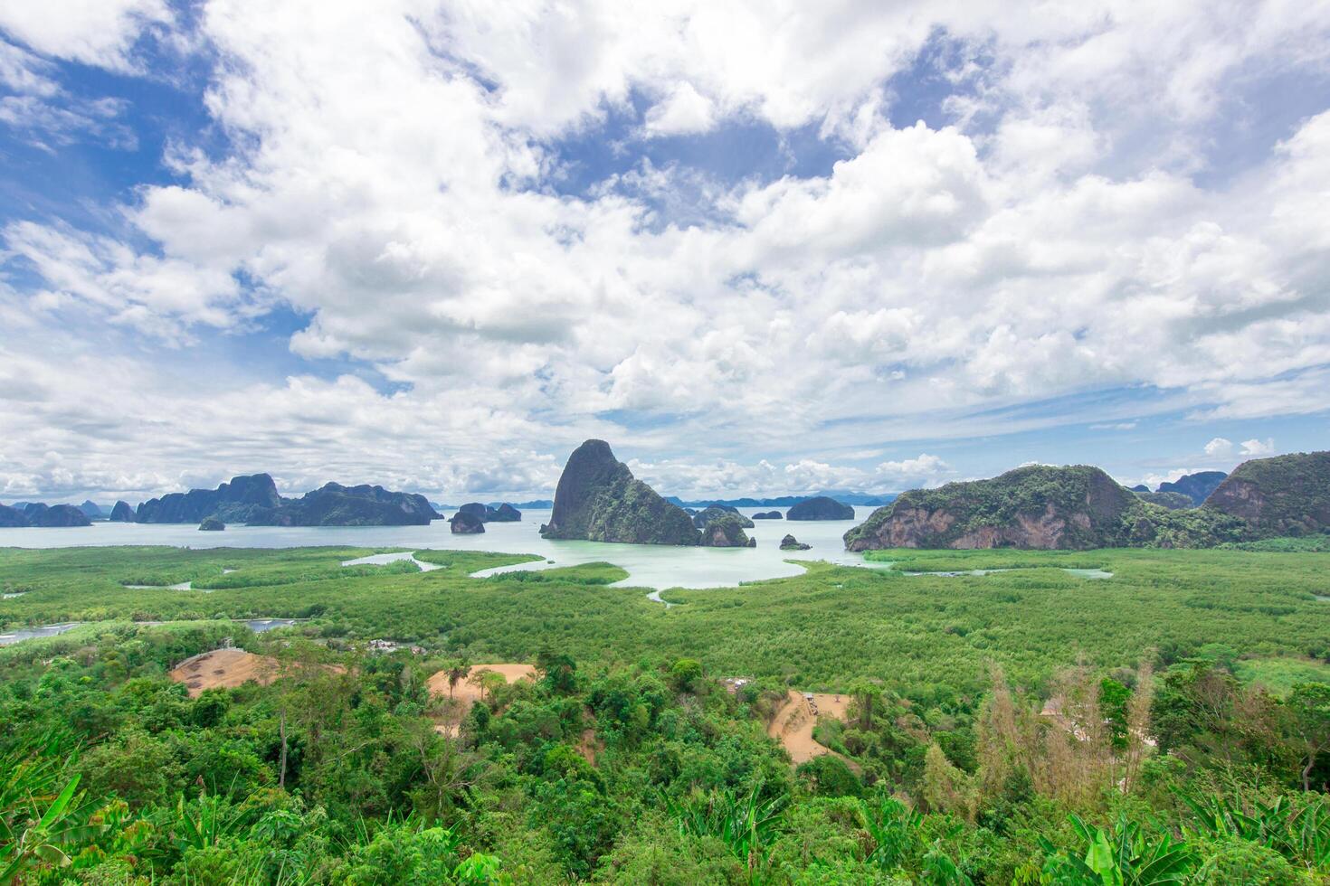 Mountain view and sea with blue sky cloud land mark for tourists in Samed Nang Phi,Phang Nga,Thailand photo