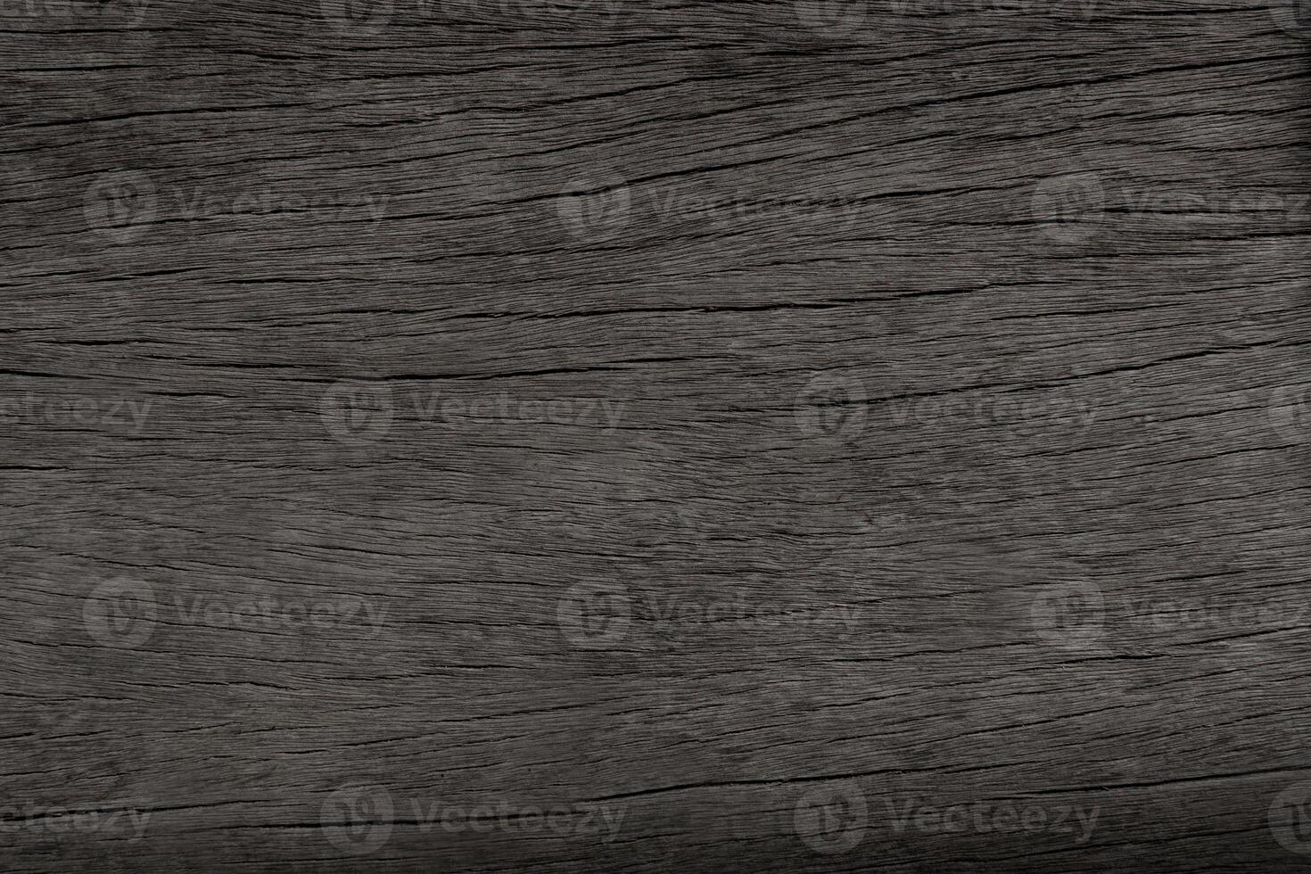 Dark brown wood and uneven surfaces for texture and copy space in background photo