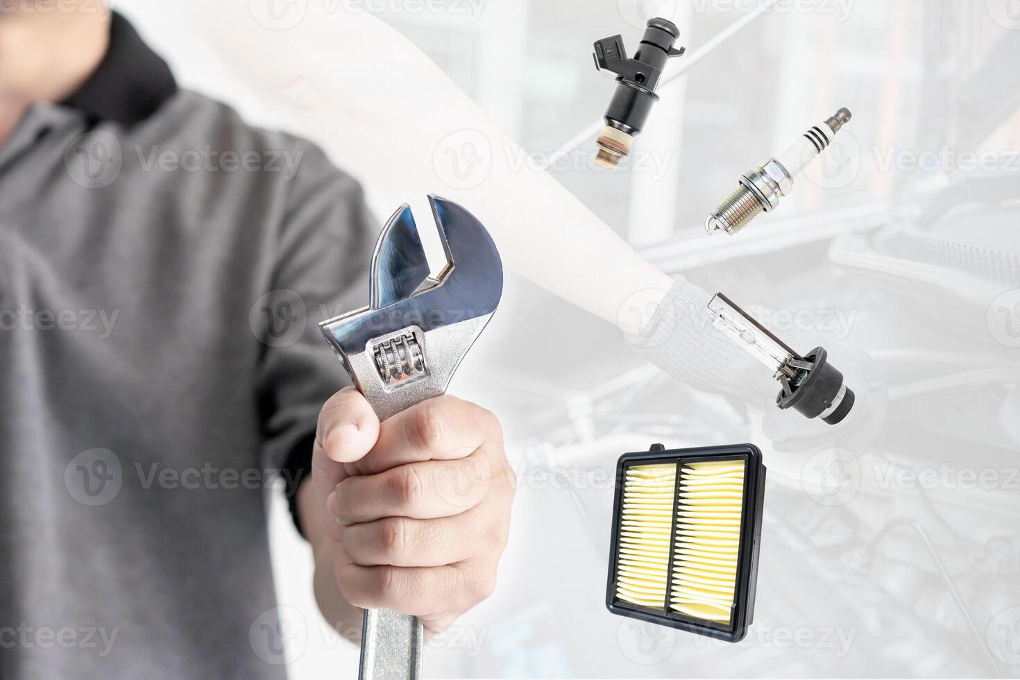 Hand of technician man holding a wrench in maintenance part background in service concept of automobile photo