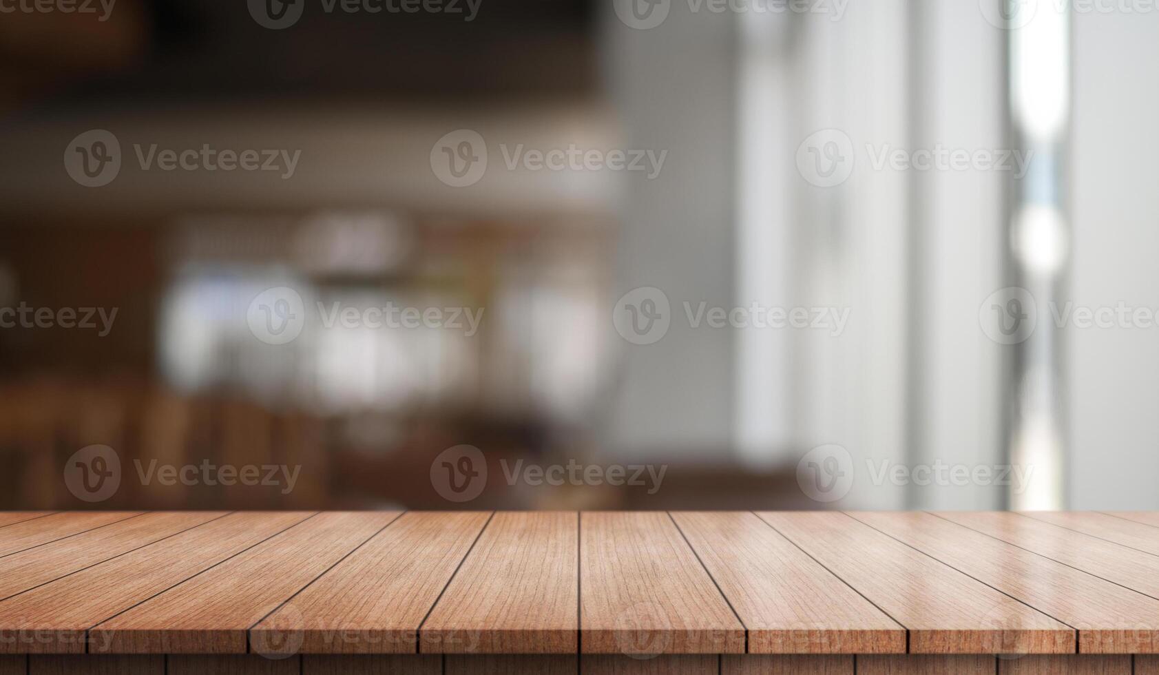 Empty wooden table top with lights bokeh on blur restaurant background. photo