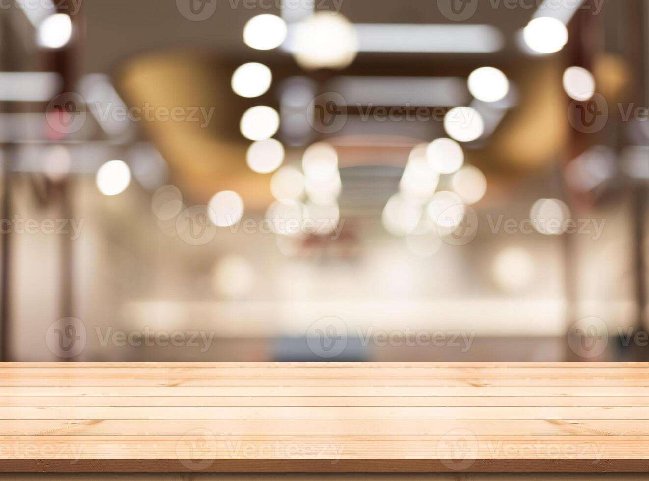 Empty wooden table top with lights bokeh on blur restaurant background. photo