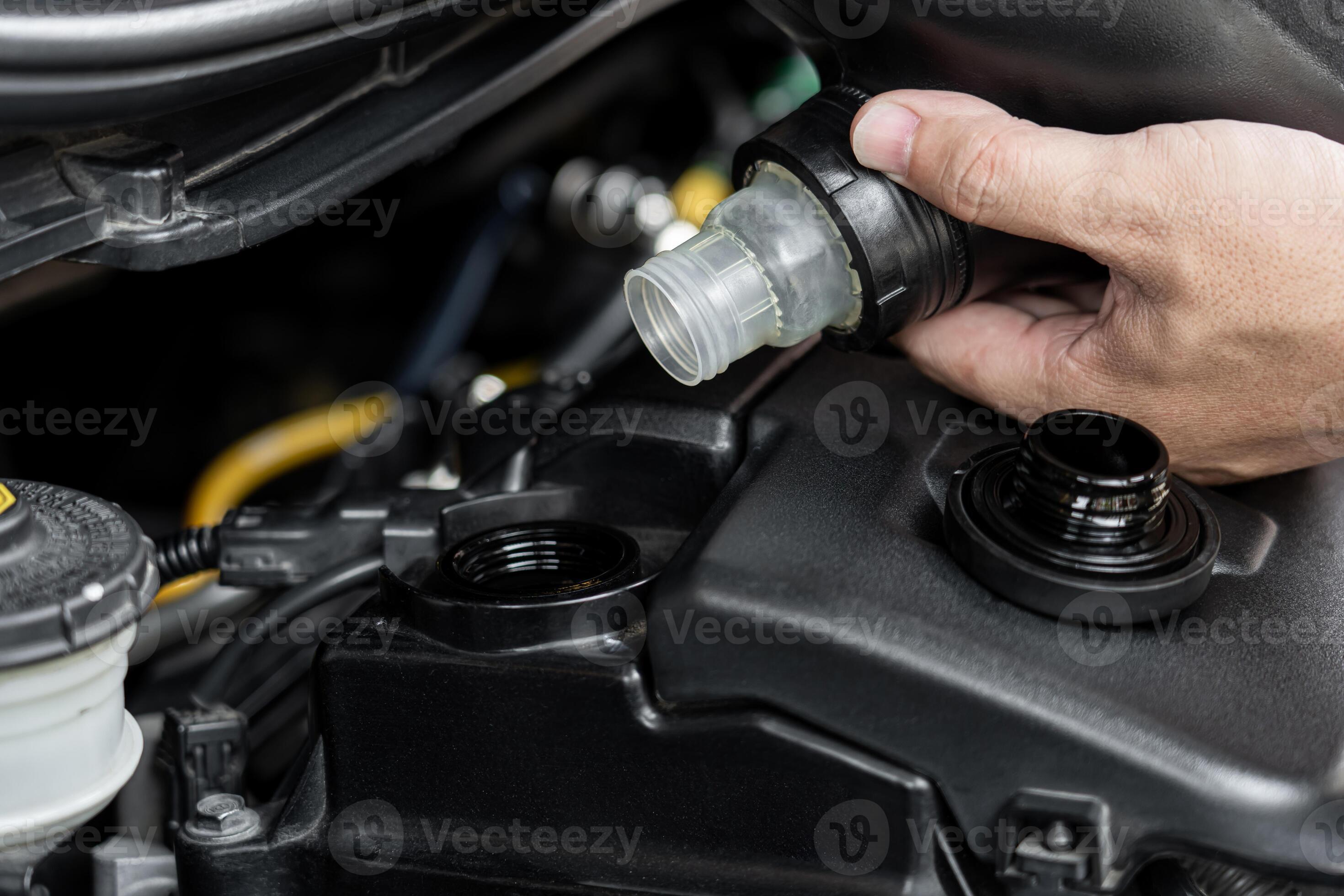 Refueling and pouring oil Adding engine oil in engine motor car