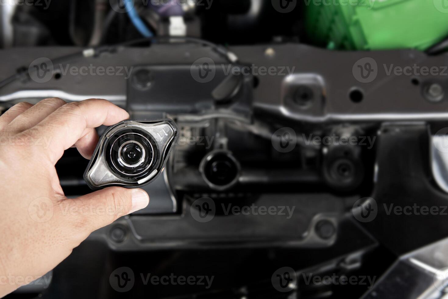 Hand a man open the Radiator cap of engine for check level of water Car radiator basic checking on car service concept photo