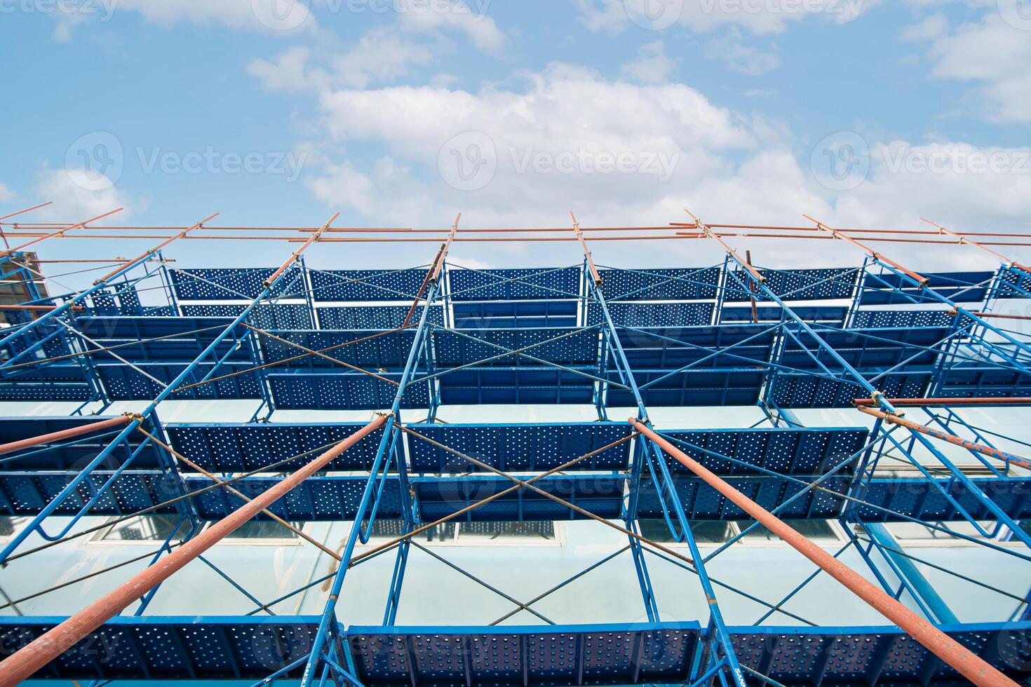 Scaffolding pipe for repair paint and water leak of tower and blue sky background photo
