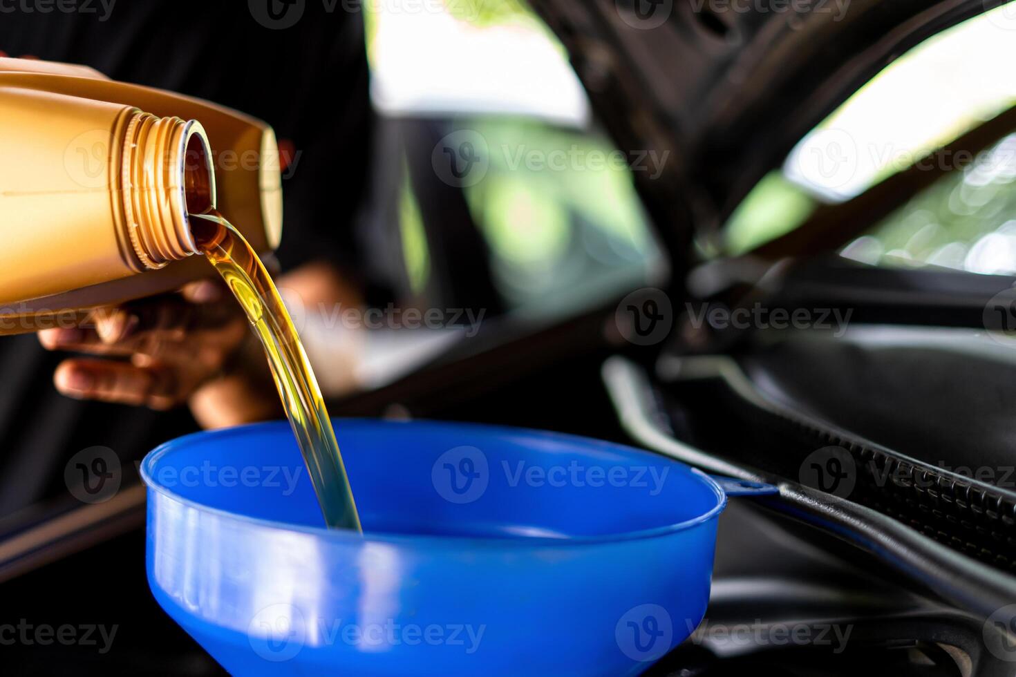 A man Refueling and pouring oil Adding engine oil in engine motor car