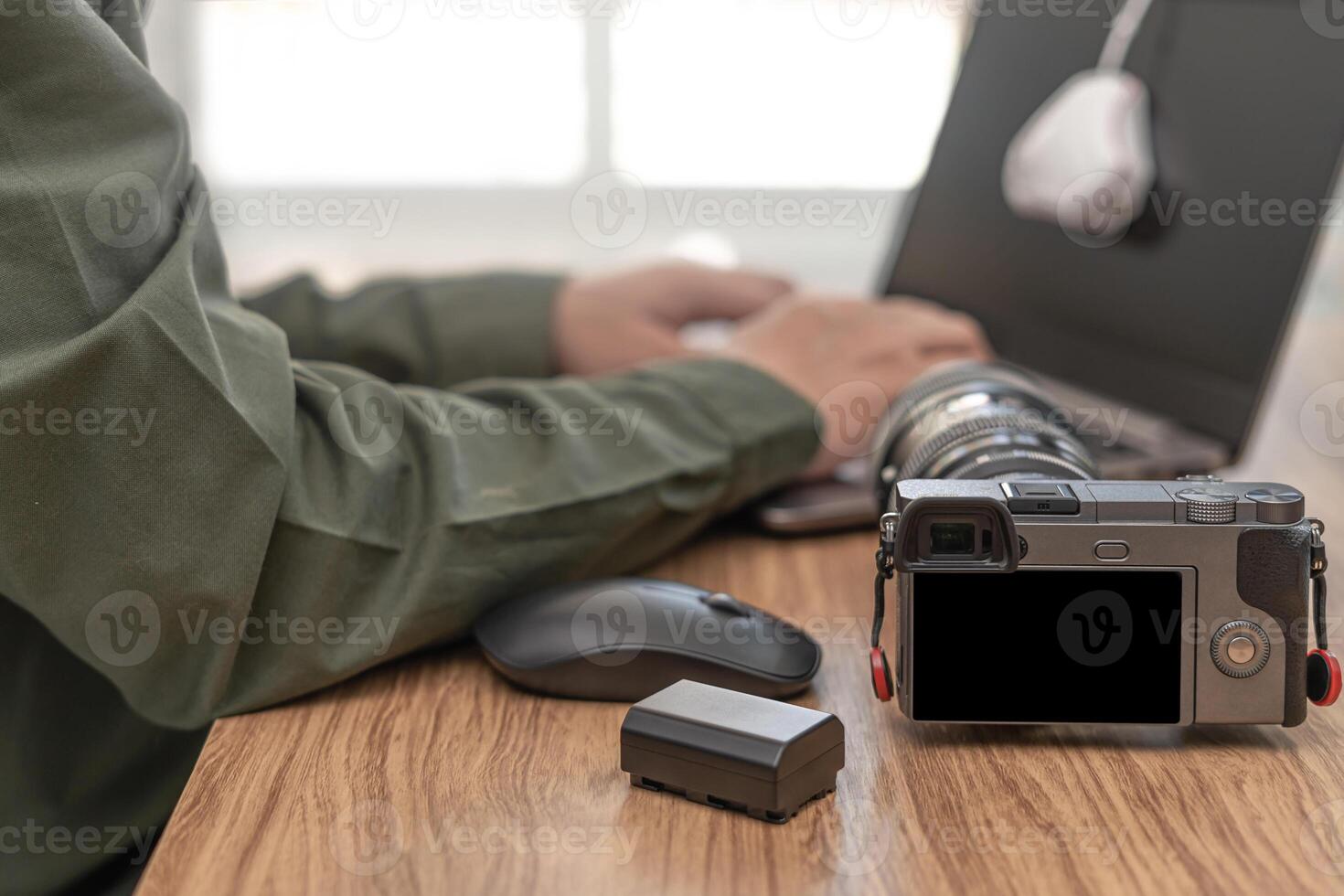 Close up camera with photographic equipment on the table and a man display calibration for monitor standard in photographic work photo