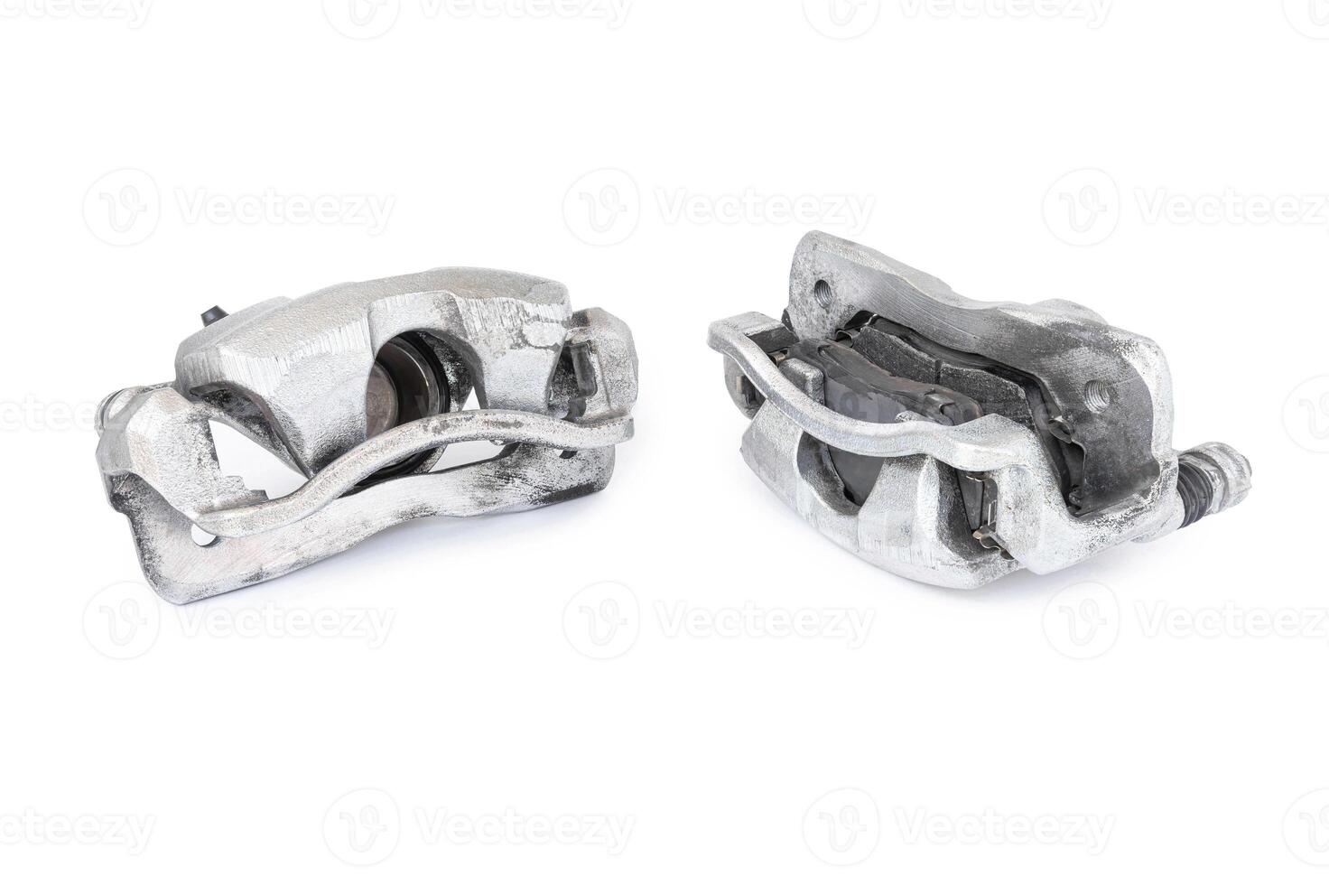 Old front caliper brake and brake pad of car in white background photo