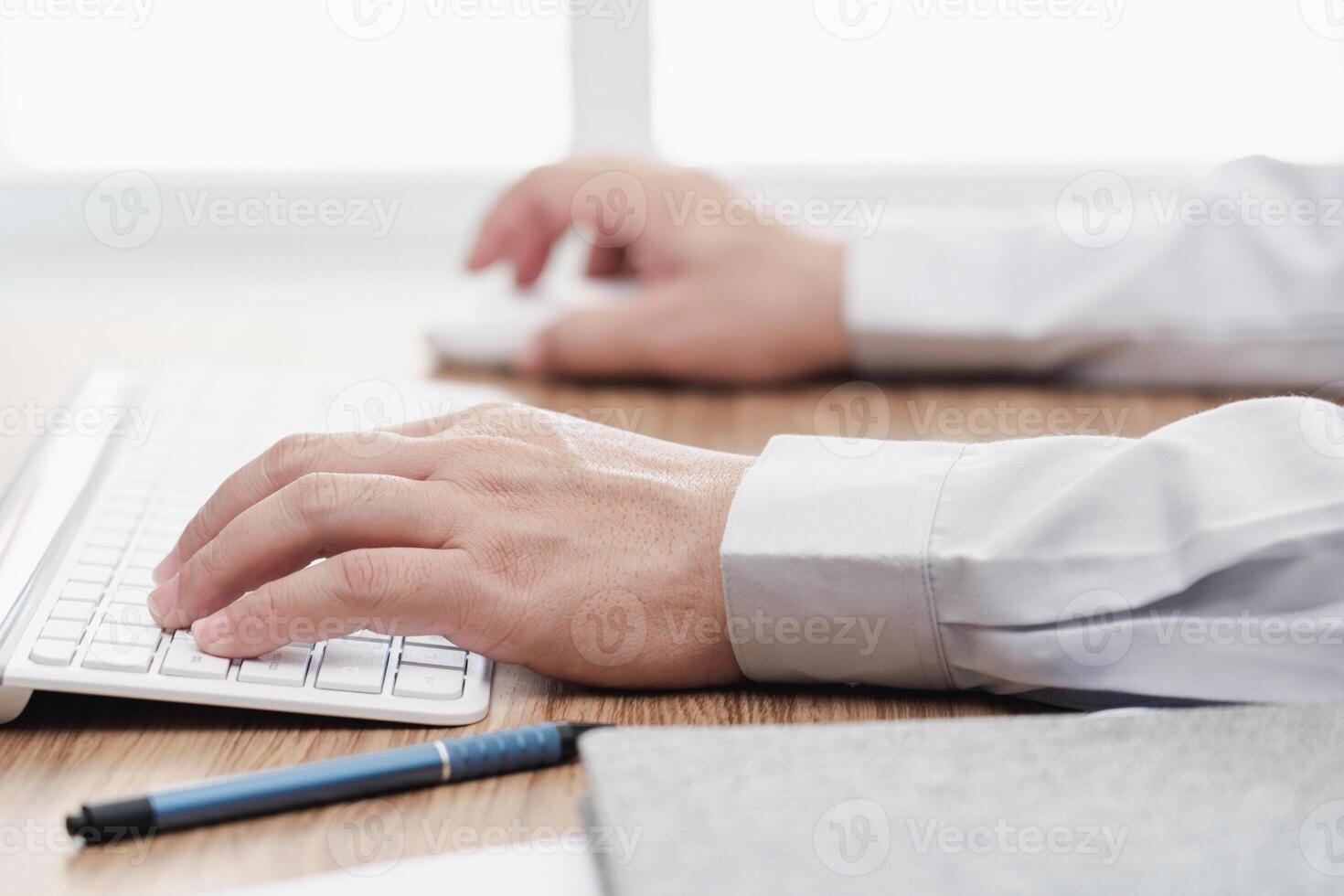 Hand a man typing on keyboard on wood table working concept in office photo