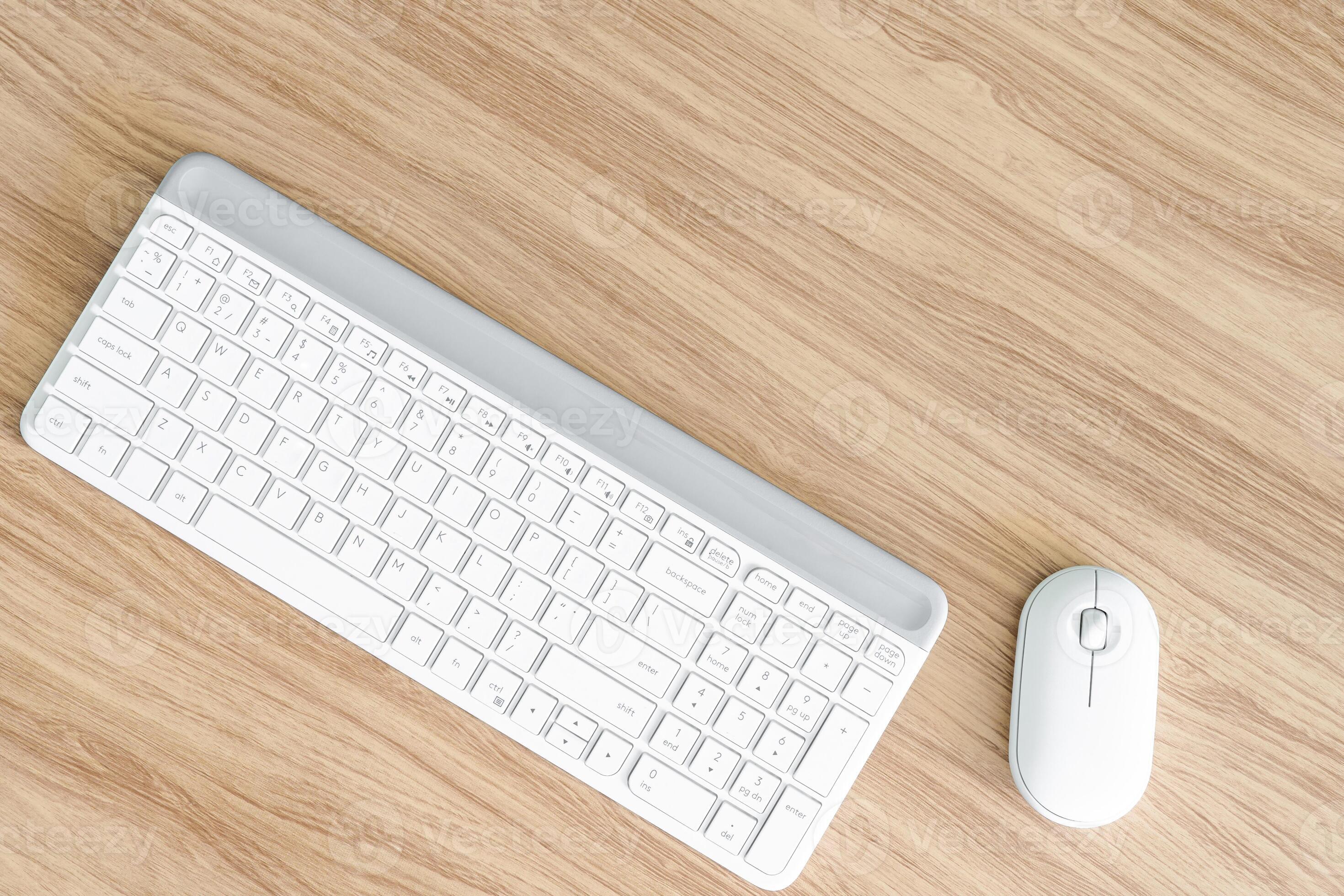 White keyboard and mouse computer on the light brown wood 37147288 ...