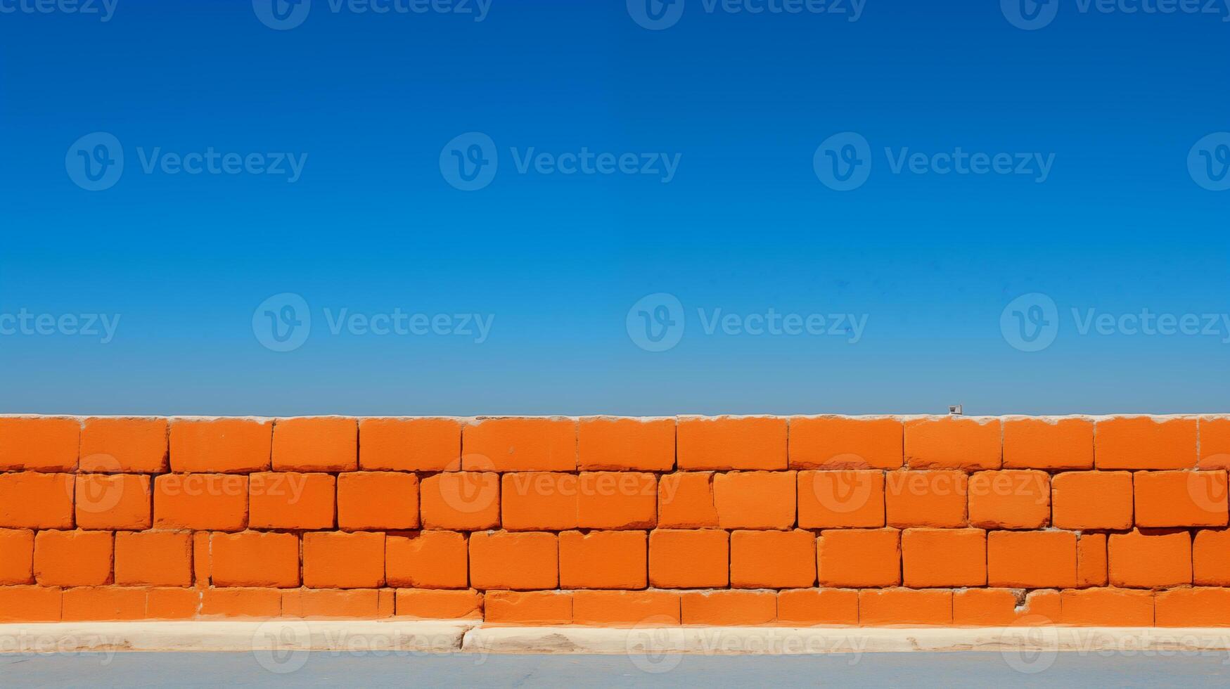 AI generated Vibrant Orange Brick Wall Against Clear Blue Sky photo