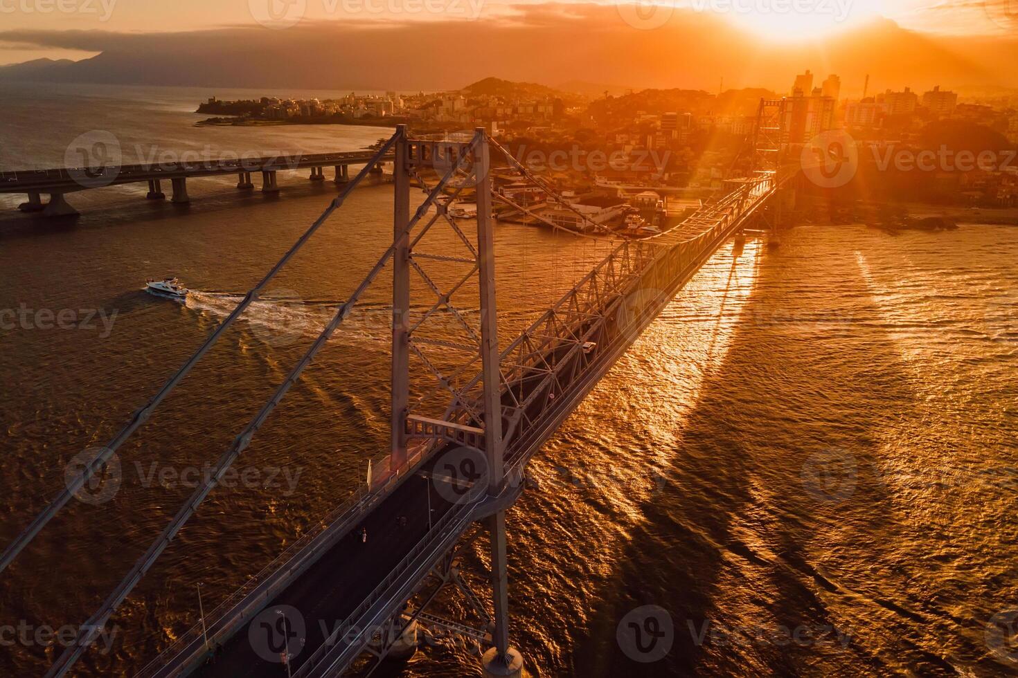 Cable bridge with sunset in Florianopolis, Brazil. Aerial view photo