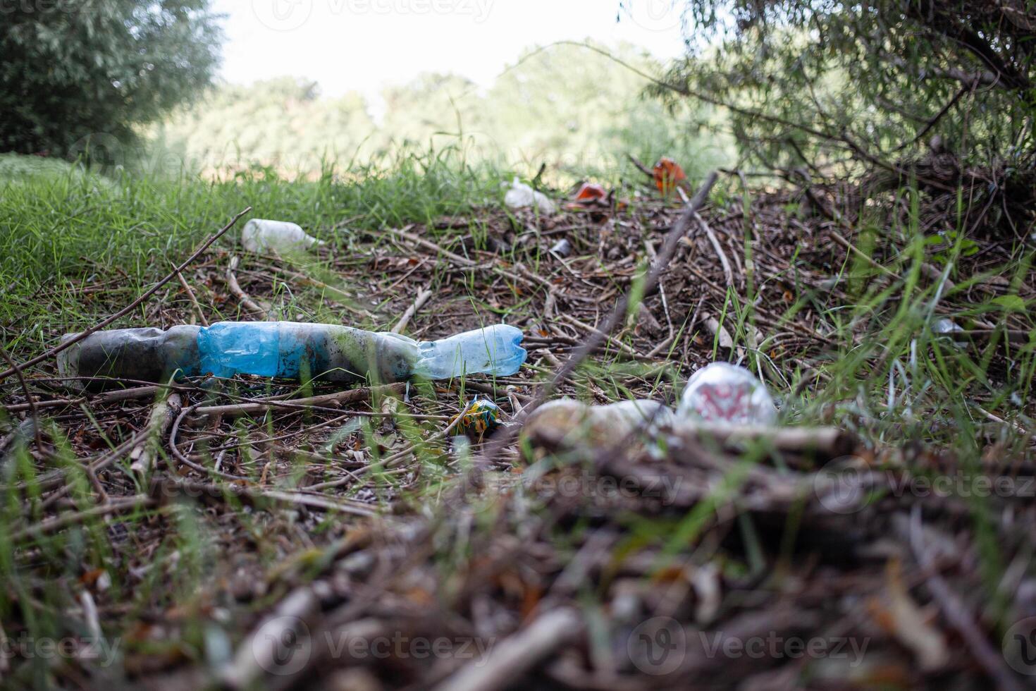 Pile of garage on green grass in the nature environment problems. Nature. photo