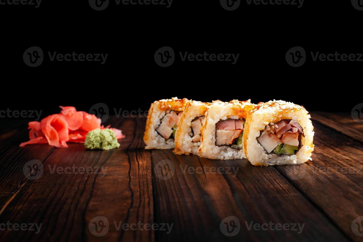 Japan sushi rolls isolated on black background photo