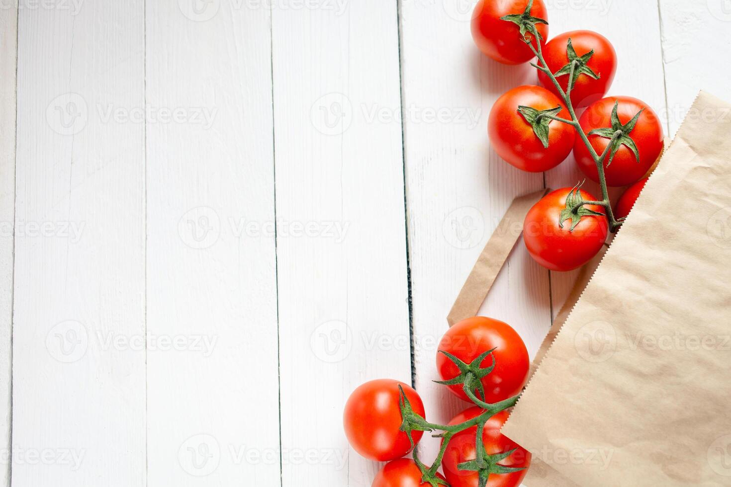 Paper bag on a wooden background, vegetables from the store photo