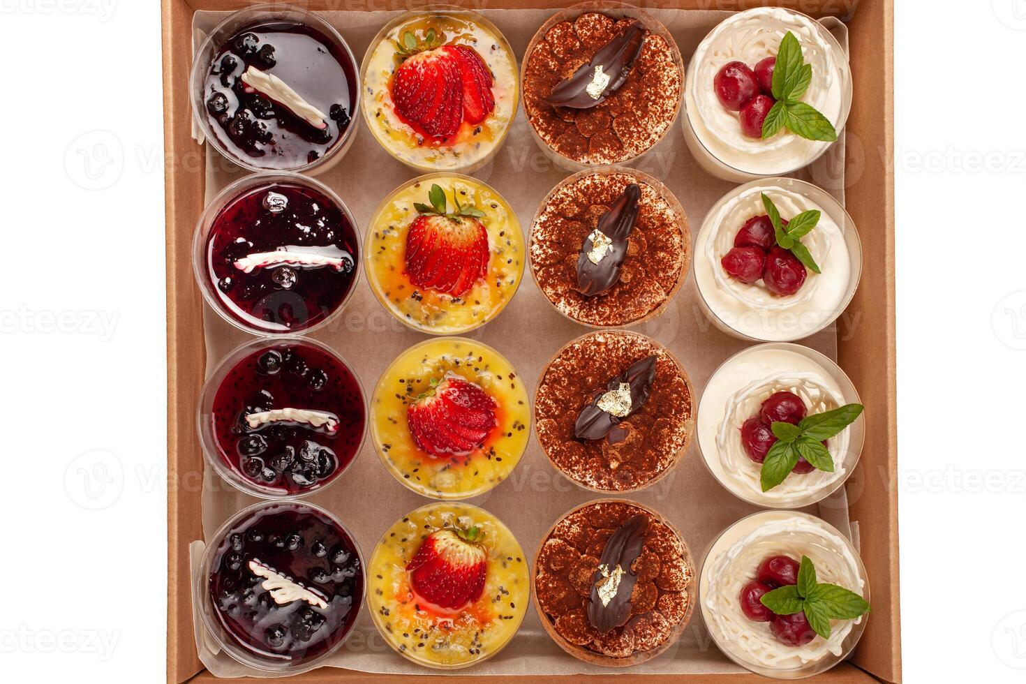 Food delivery box for Dinner. Food delivery from markets and restaurants. Meal for a week on quarantine. Fresh Desserts tiramisu, souffle jelly at the craft box. Contactless food delivery photo
