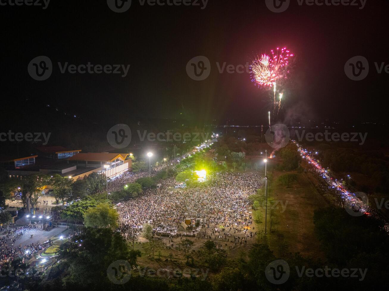Celebration. Skyline with fireworks light up sky in Ba Den mountain, Tay Ninh city, Vietnam. Beautiful night view cityscape. Holidays, celebrating New Year and Tet holiday photo