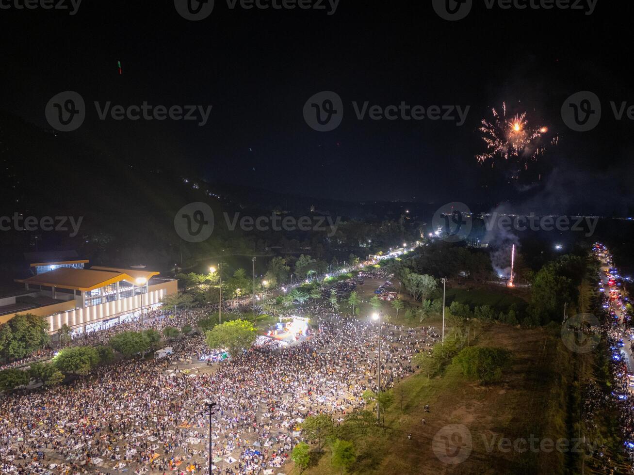 Celebration. Skyline with fireworks light up sky in Ba Den mountain, Tay Ninh city, Vietnam. Beautiful night view cityscape. Holidays, celebrating New Year and Tet holiday photo