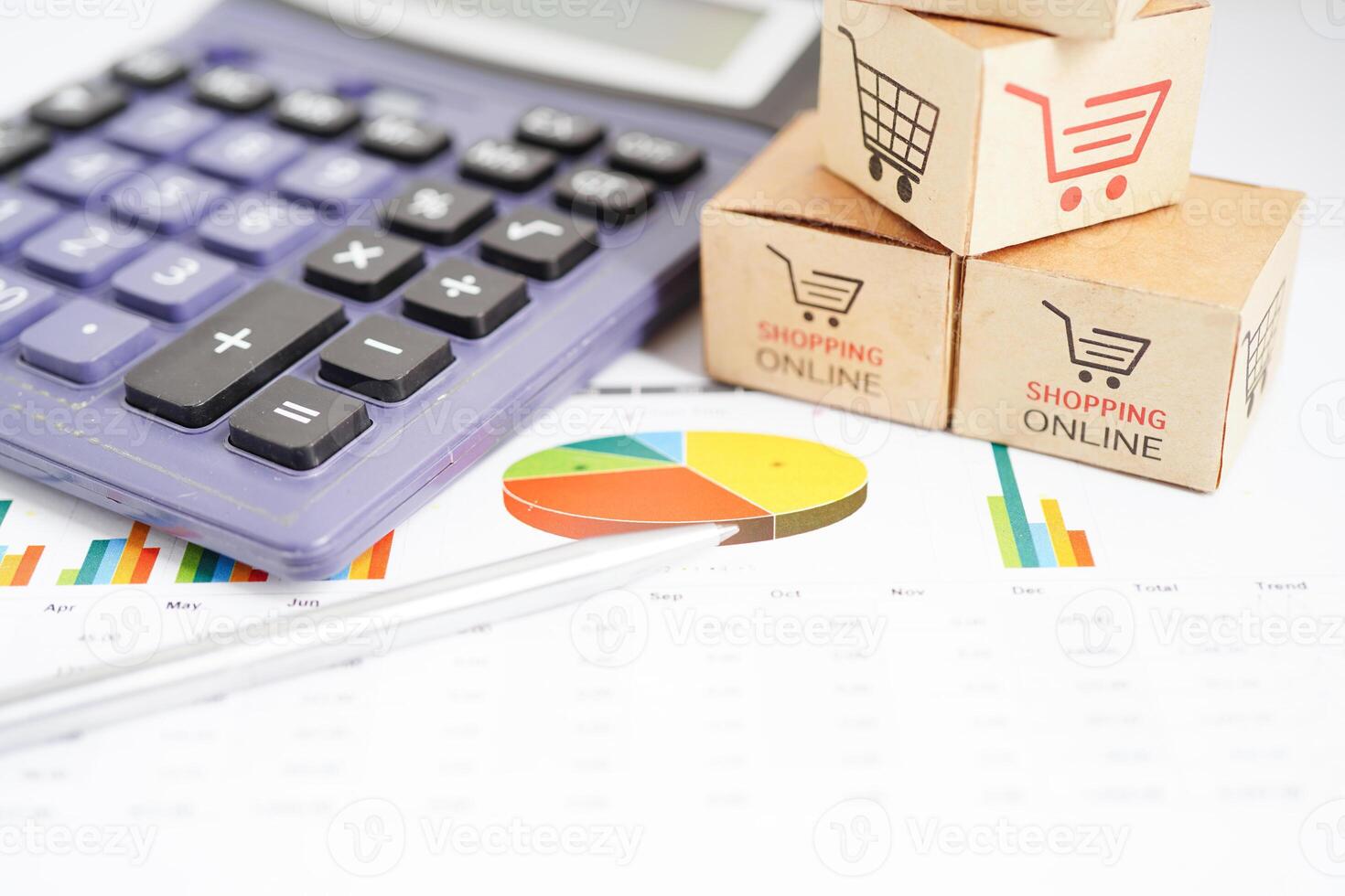 Online shopping, Shopping cart box on business graph, import export, finance commerce. photo