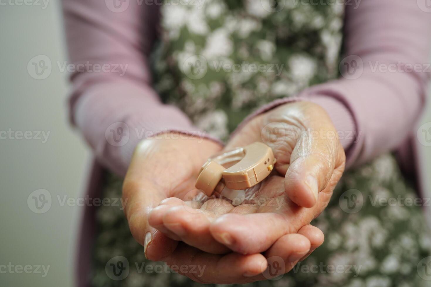 Ear of asian senior woman with hearing problem. photo