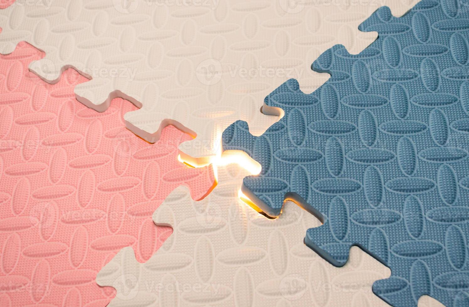 Concept for teamwork, problem solving or mystery stuff. Jigsaw puzzle with a glowing light. After some edits. photo