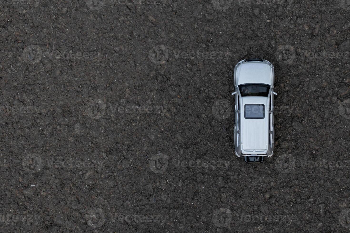 Concept for traveling and outdoor activities. Photo of a toy car on the road. After some edits.