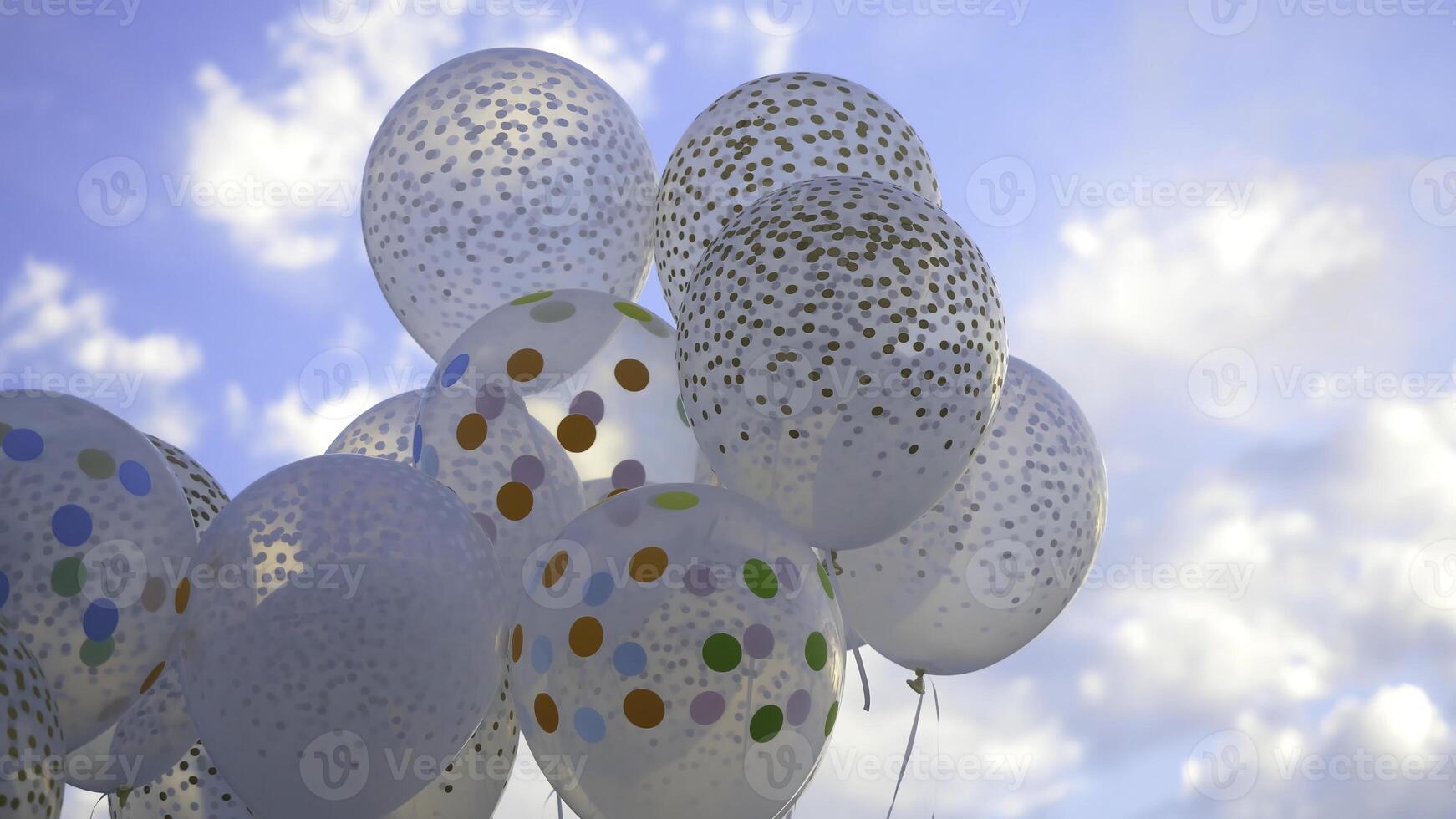 White balloons against the sky. White balls in the sky photo