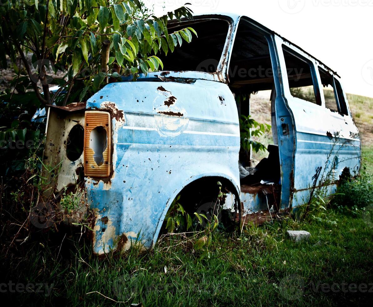 Abandoned Vehicle on Field photo