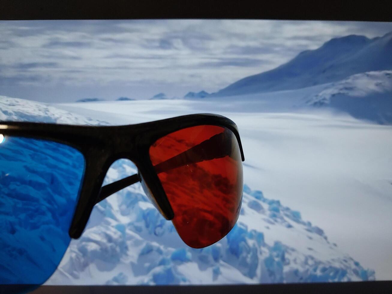KYIV, UKRAINE - January 12, 2024 Watching movies with anaglyph 3D glasses photo