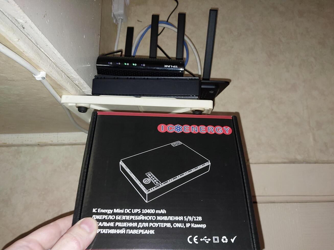 KYIV, UKRAINE - January 4, 2024 Uninterruptible power supply for modem and router photo