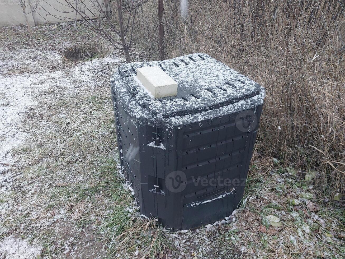 Snow fell on garden items in the village photo