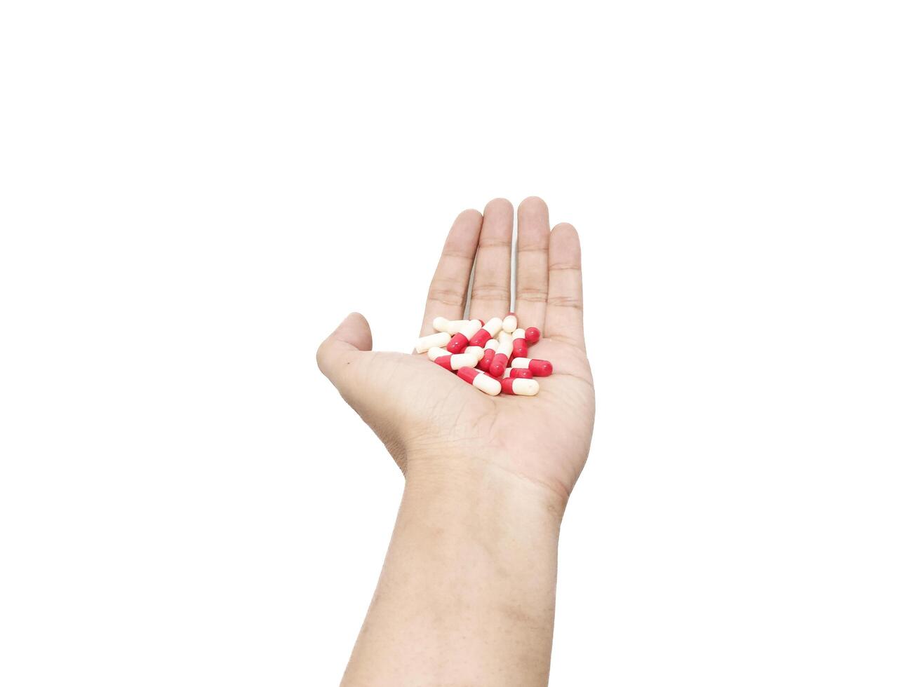 capsule pills placed in the palm of the hand isolated on a white background photo