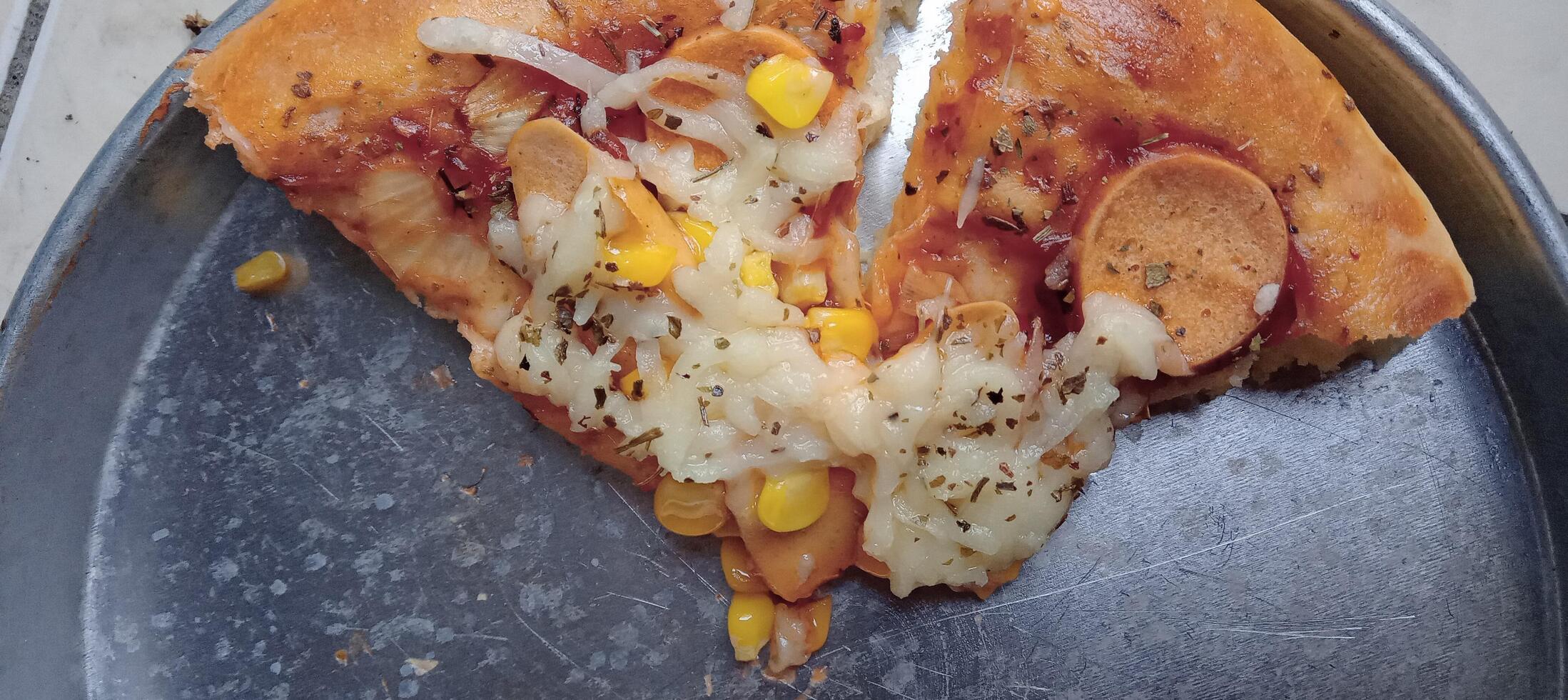 Corn pizza with cheese and sausage photo