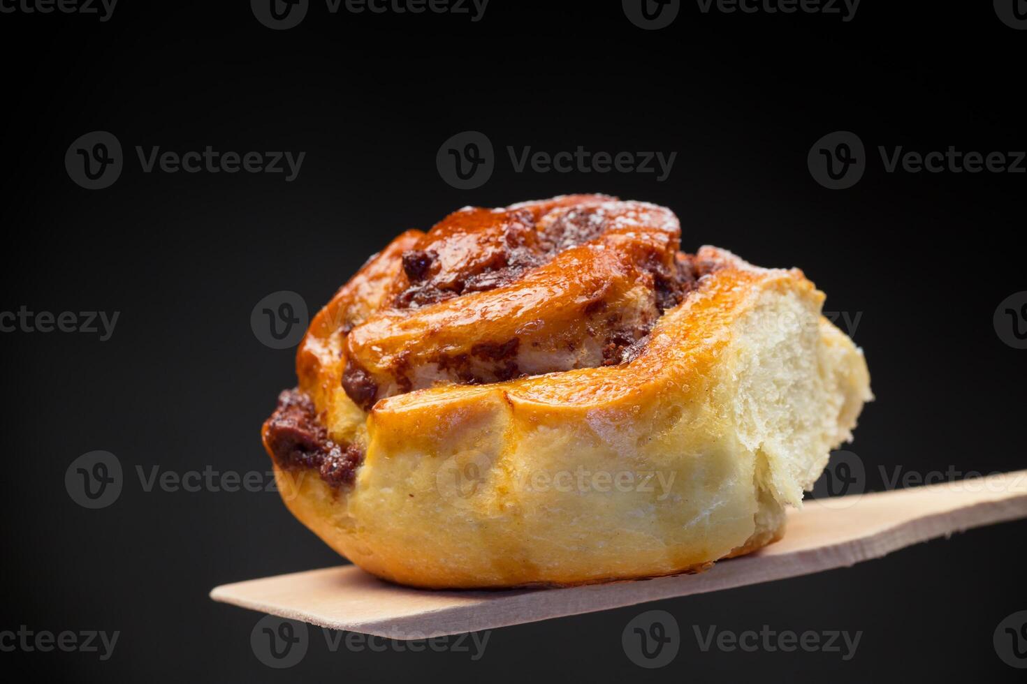 cooked baked sweet bun rolls with chocolate filling photo