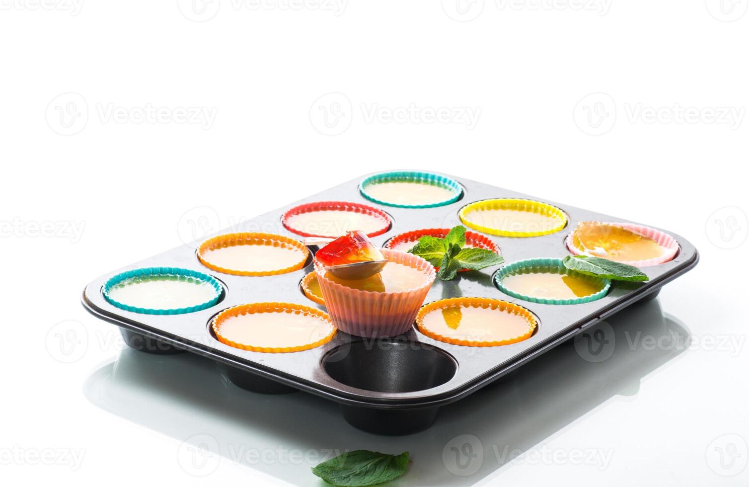 lot of colored sweet fruit jelly in a glass photo