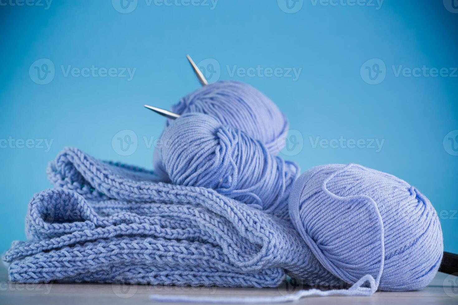 Set for hand knitting, blue yarn, knitting needles. photo