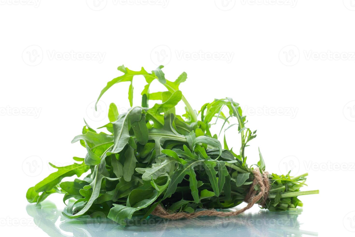bunch of fresh organic green arugula on white background photo