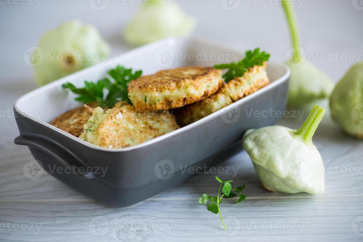 vegetable fried squash and zucchini cutlets in a ceramic form photo