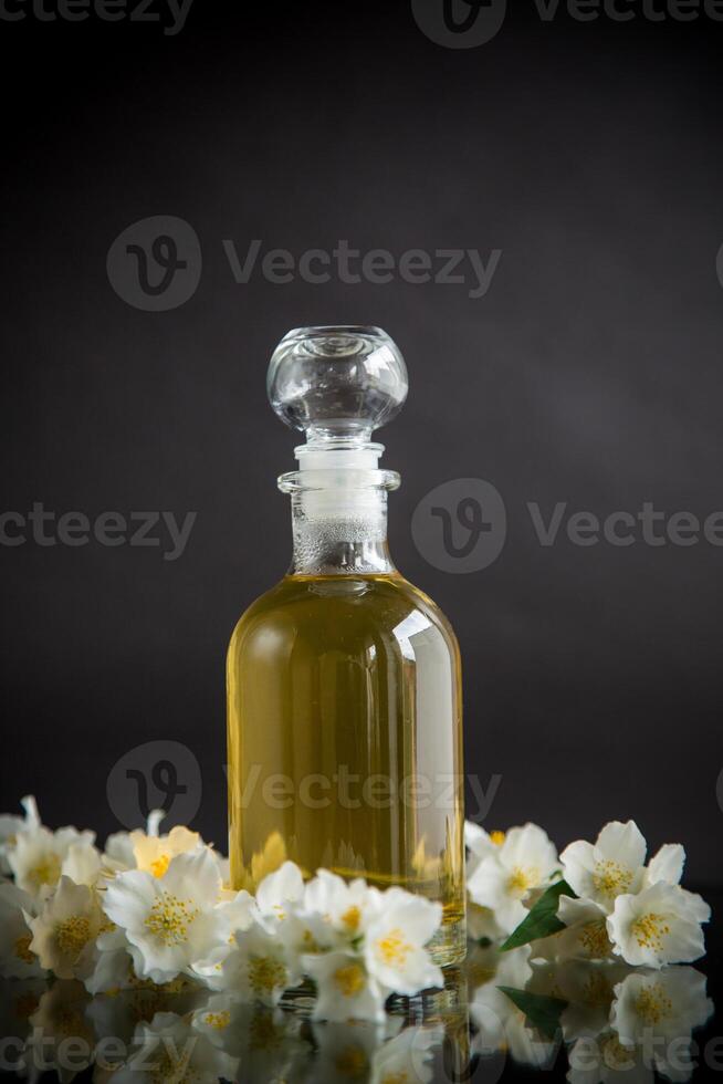 medicinal herbal tincture with jasmine in a glass bottle photo