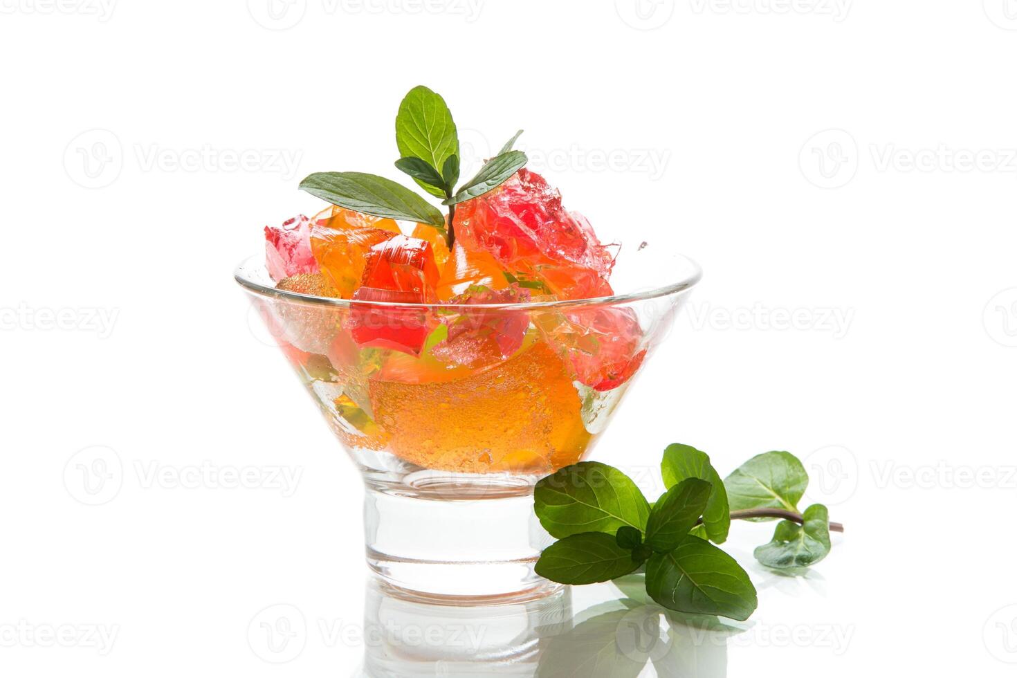 colored sweet fruit jelly in a glass glass photo